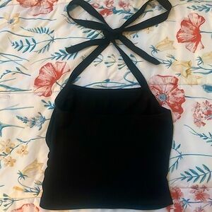 Two black and grey halter tops, semi opened backed with adjustable ties.